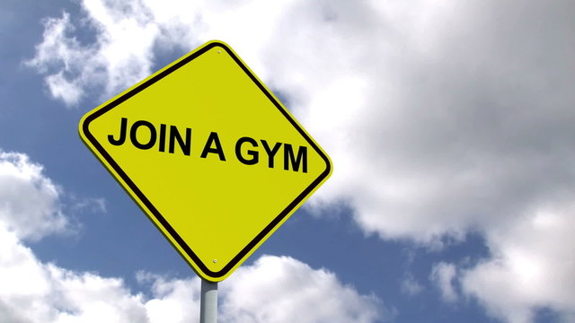 Join a gym sign against blue sky