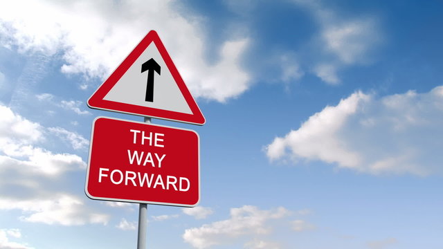 The way forward sign against blue sky