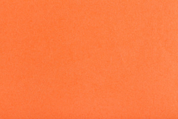 background from sheet of dark orange fiber paper