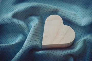 heart  wooden box on cloth fabric background