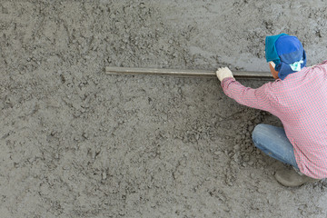 plasterer concrete cement worker plastering flooring of house co