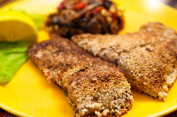 The fried fish carp with sesame seeds