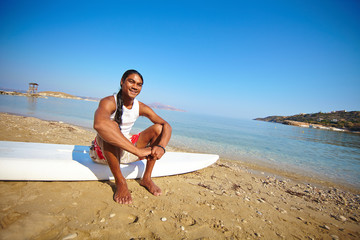 Fototapeta na wymiar Surfer on the seashore