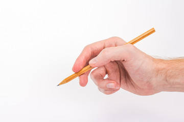 isolated male hand writing with a pencil
