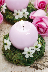 Candle holder made of moss, decorated with arabian star flowers