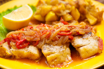 the peach fish with sauce and vegetable