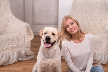 Beautiful  blond girl with Labrador Retriever