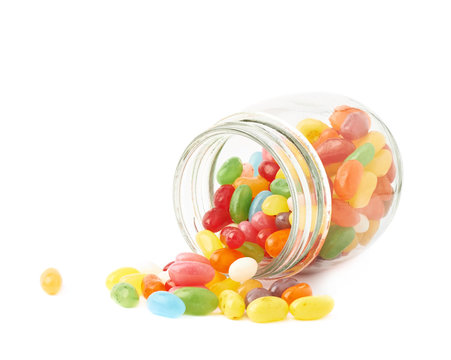 Jelly bean candies spilled out of jar