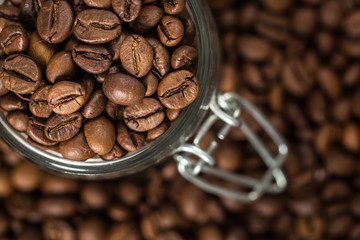 Coffee beans in a glass jar. 