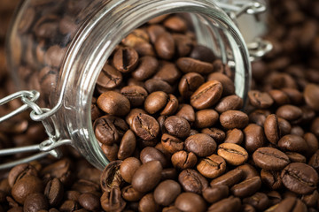 Coffee beans in a glass jar. 