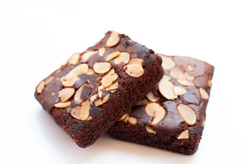 Fototapeta na wymiar Chocolate brownie portions with almond slice