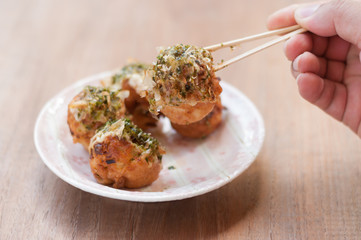Takoyaki, delicious Japanese style octopus pancake, topping with