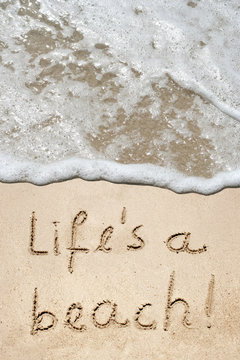 Conceptual life is a beach text in sand and water
