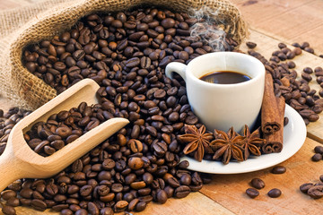 coffee cup and grains on wooden table