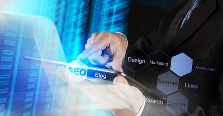businessman hand showing search engine optimization SEO as conce