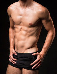 Fototapeta na wymiar Muscled sexi torso of a man