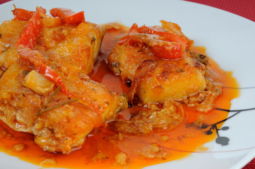Fish dish with onions and peppers sauce