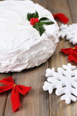 Christmas cake on wooden table background