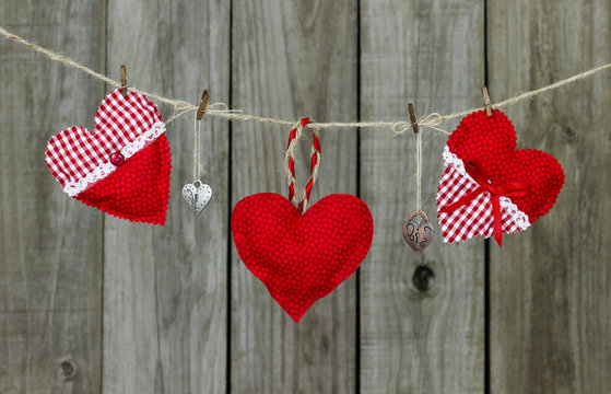 Red hearts and locks hanging on clothesline - Powered by Adobe