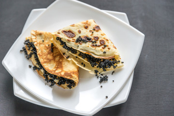 Crepes with black caviar