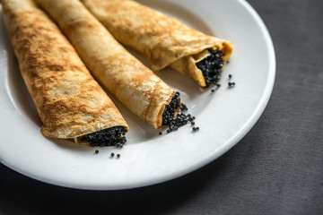 Crepes with black caviar