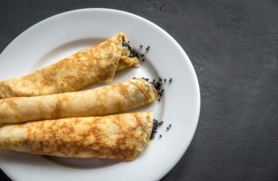 Crepes with black caviar