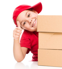 Happy girl holding cardboard boxes
