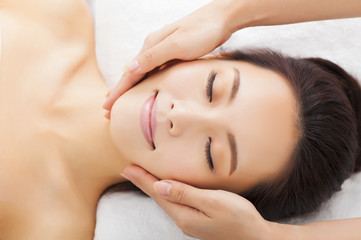 Obraz na płótnie Canvas massage of face for woman in spa salon