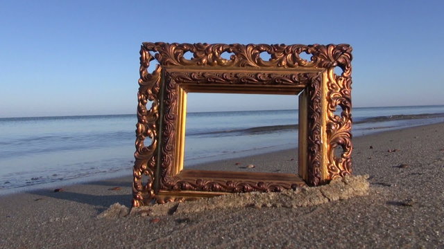 beautiful ancient ornate picture frame on sea resort beach