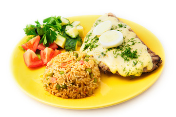 the pork steak with egg and rice on the yellow plate