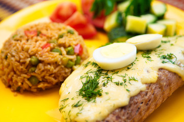 the pork steak with egg and rice on the yellow plate
