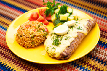 the pork steak with egg and rice on the yellow plate