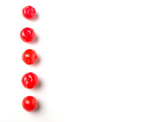 Pickled cherry fruit over white background