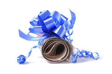 Rolled newspaper with decorative bow