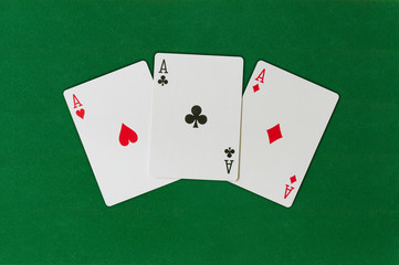 Three Ace backgroundon the green background