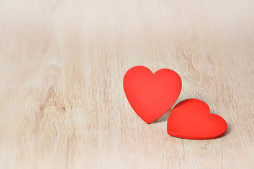Fototapeta premium Red hearts on wooden background