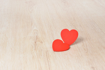Red hearts on wooden background