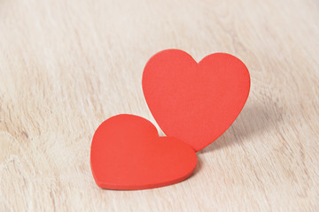 Red hearts on wooden background