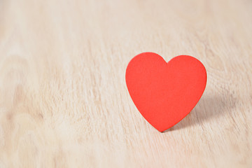 Red hearts on wooden background