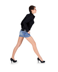 Young female with long legs standing over white