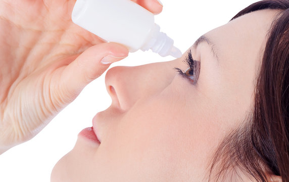 Woman Dripping Eye With Eyes Drops