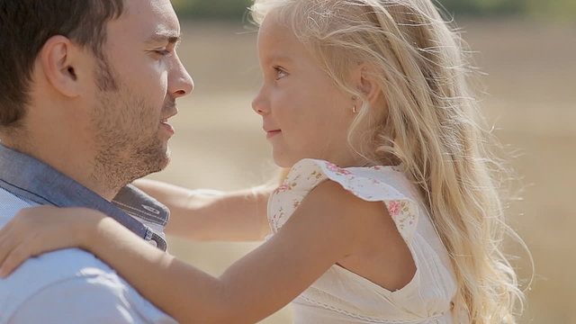 Little girl fooling around on father's hands