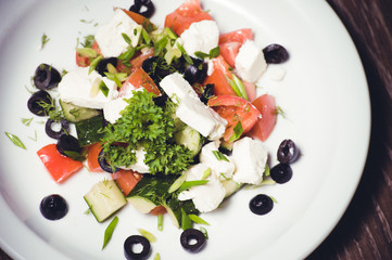 vegetarian greek salad served on plate
