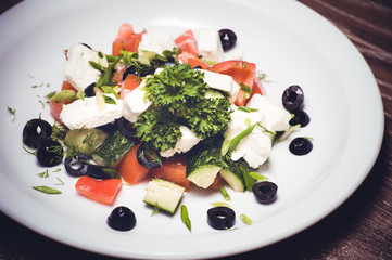 vegetarian greek salad served on plate