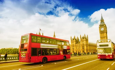 Foto op Canvas Two red buses crossing Westminter Bridge on a sunny day in Londo © jovannig