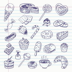Freehand drawing sweetness items on a sheet of exercise book