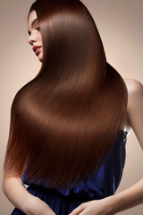 Brown Hair. Portrait of Beautiful Woman with Long Hair. High qua
