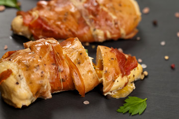 Prosciutto Wrapped Chicken breast. Selective focus.