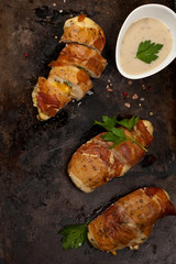 Prosciutto Wrapped Chicken breast. Selective focus.