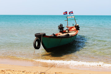 Fototapeta premium fisher boat near ocean beach